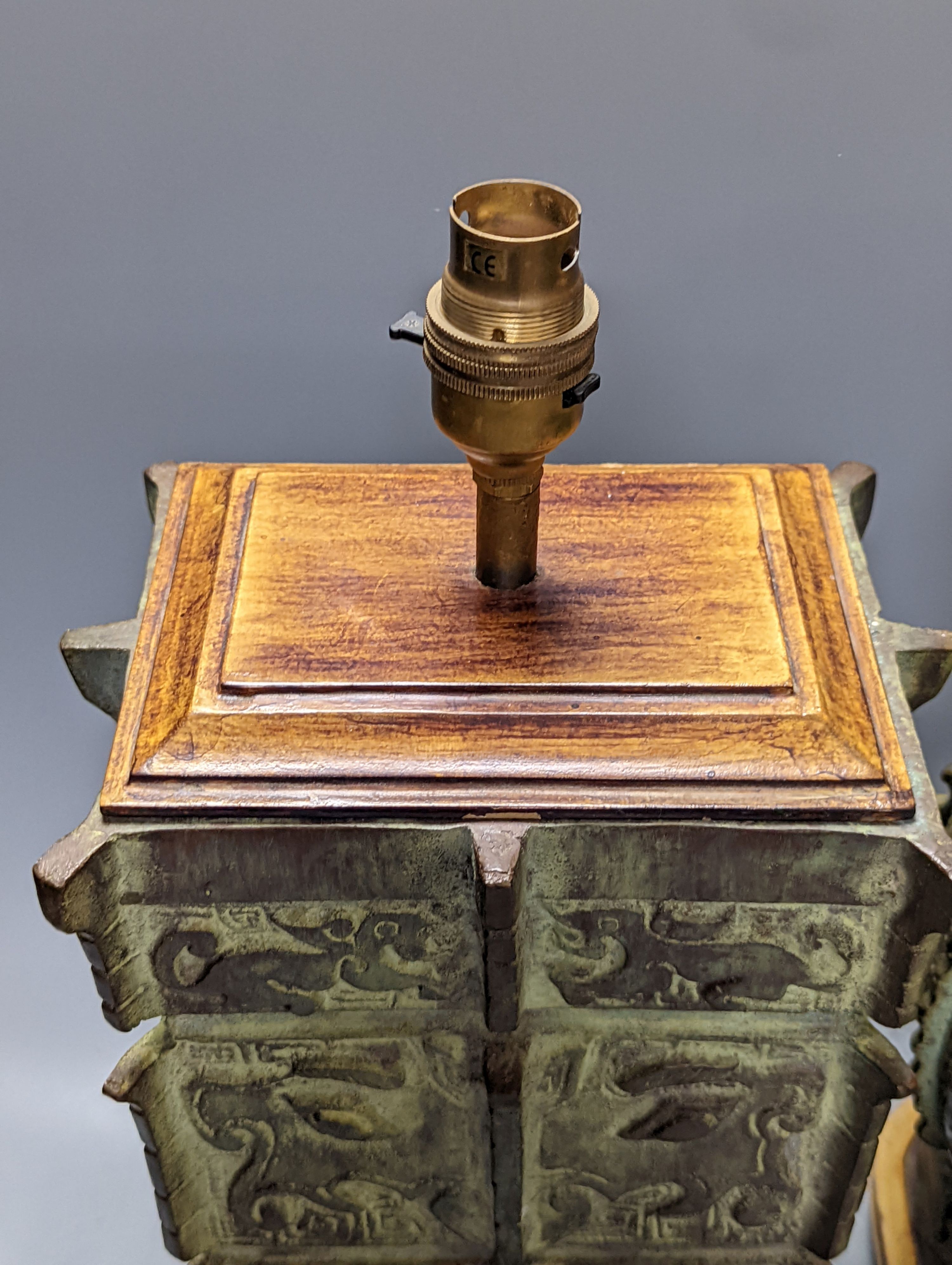 Two Chinese archaic style bronze lamp bases, 38 cm high to top of fitting